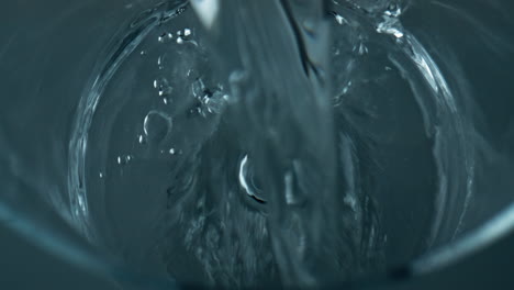 closeup water stream pouring empty glass. mineral pure liquid fill transparent