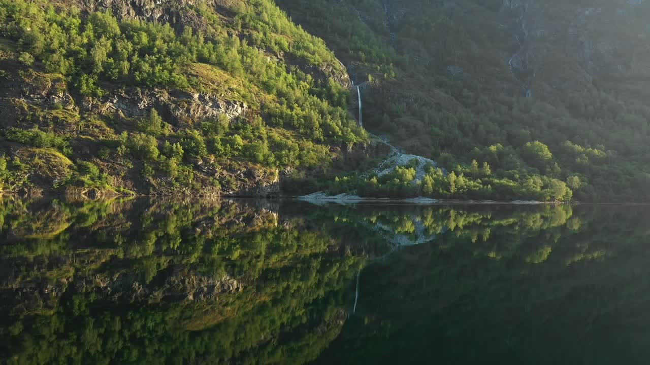 beautiful reflection shot of a waterfall in Norway