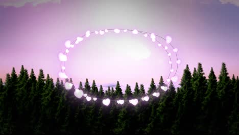 animation of fairy light frame with copy space over fir trees and winter scenery