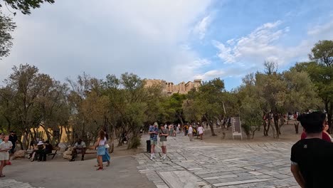 tourists exploring the parthenon surroundings in athens