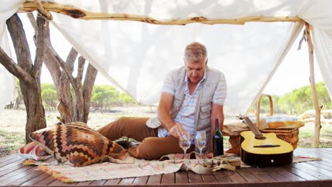 man looking at wine bottle 4k