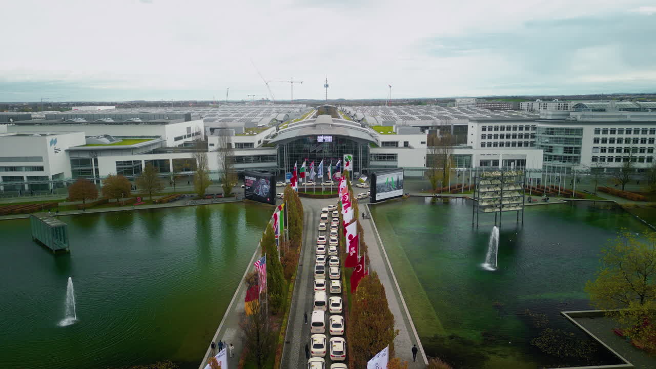 Aerial view of a convention center with flags and fountains