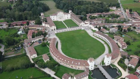 aerial backward reveal rotation drone shot of villa manin - venetian villa in udine italy