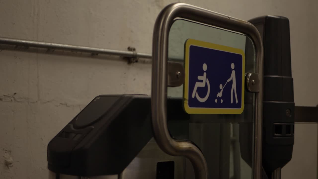 Signs for wheelchairs and prams in subway close up panning shot
