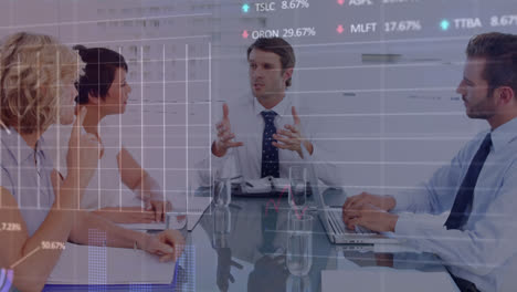 animation of financial graphs over diverse businesspeople having meeting in office