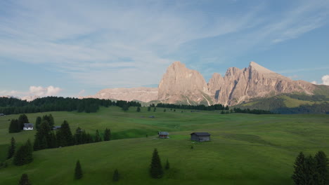 alpe di siusi with sassolungo - langkofel mountain group in background during springtime in the dolomites, italy