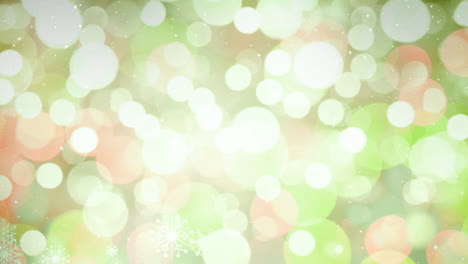 nieve cayendo con círculos de navidad de luz bokeh