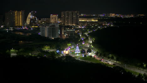 Aerial-view-of-boulevard-kukulkan-in-Cancun-Mexico-at-night-with-cars-driving-by