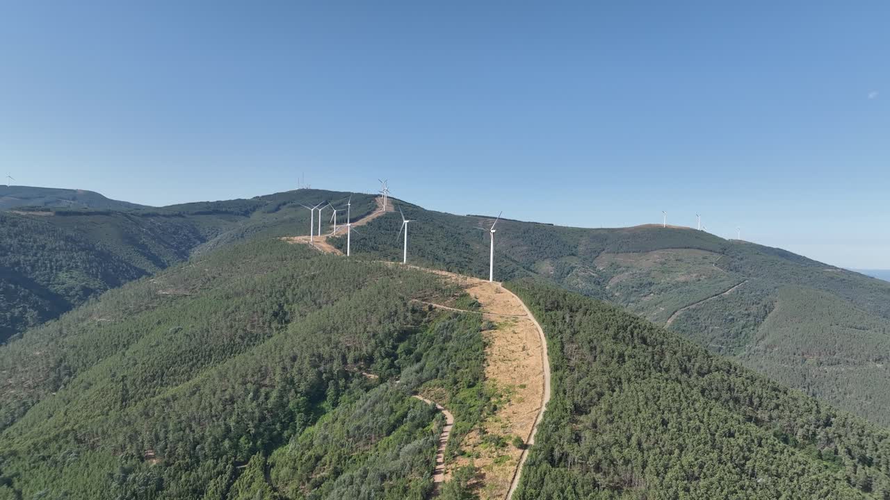 Rotating wind turbines in the countryside of Portugal.