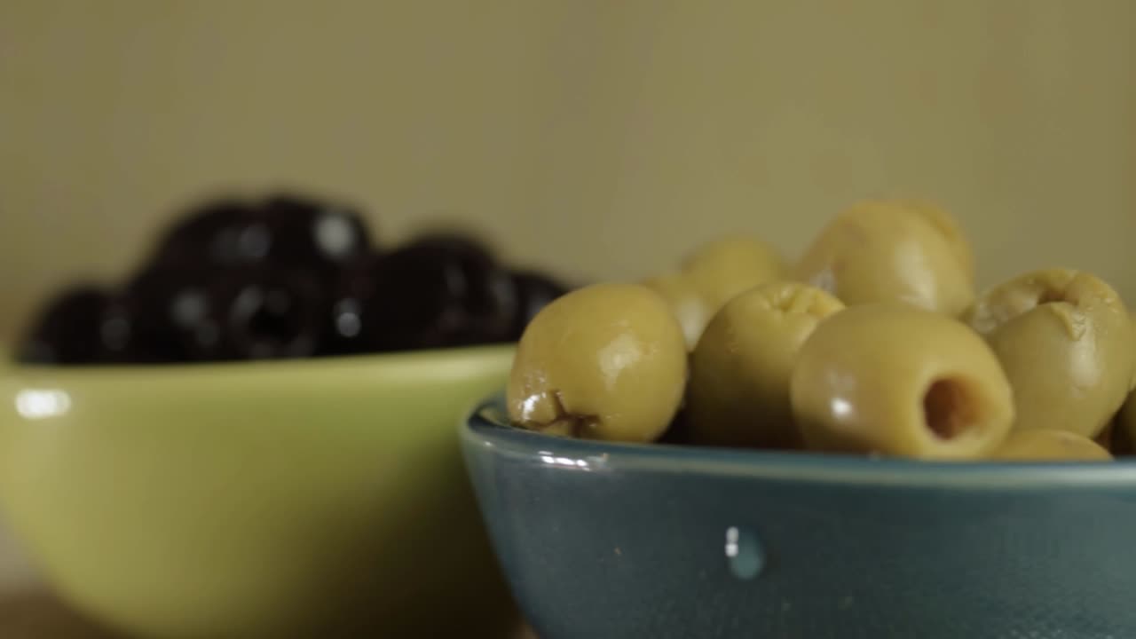 Green and black olives rotating close up shot