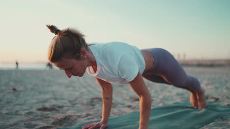 caucasian girl doing stretching exercises outdoors.