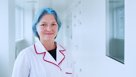 Factory-worker-woman-face.-Female-worker-portrait-in-white-corridor