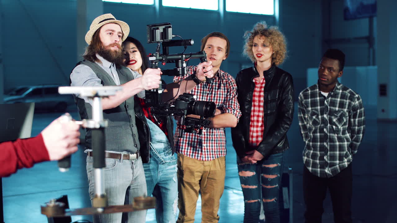 Film crew working on a film set with actors and camera operator