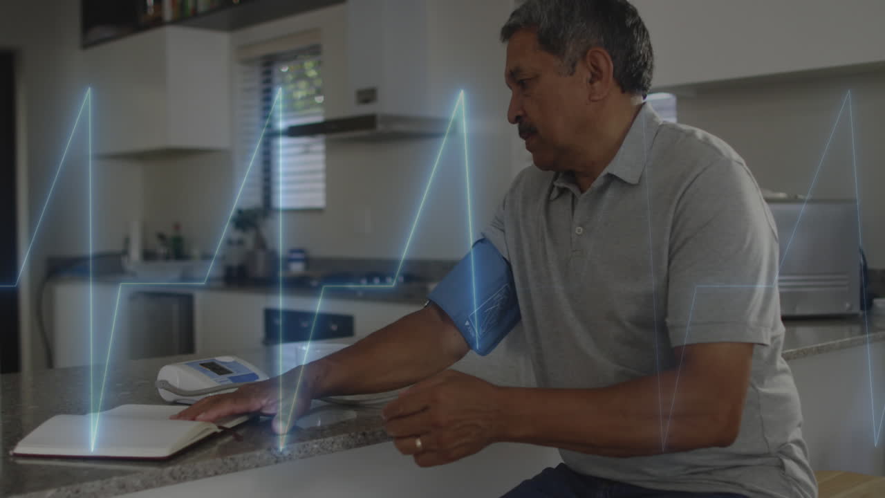 Animation of cardiogram over senior biracial man measuring blood pressure