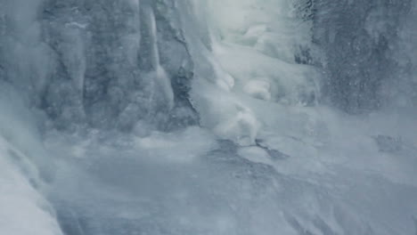 ice surface. water flowing under transparent ice. winter background