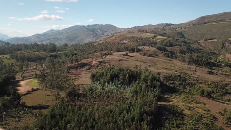 scenic aerial shot of rolling hills covered in greenery, blending forests and open fields. the rural landscape offers a peaceful, untouched natural setting, perfect for environmental, travel content