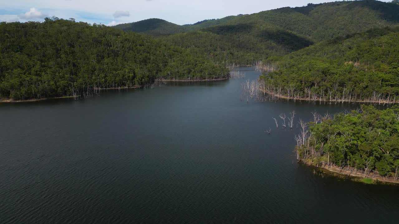 Right to left aerial views of Advancetown Lake near the Western Boat Ramp on the Gold Coast Hinterland.
