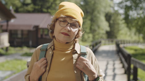 senior woman hiking in the woods