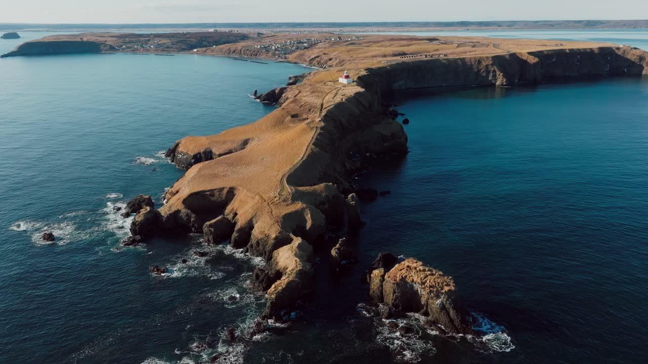 Aerial View Of Cape Kiritappu With Tobutsumisaki Lighthouse In Sunlight. Akkeshi District, Hokkaido, Japan. sideways shot
