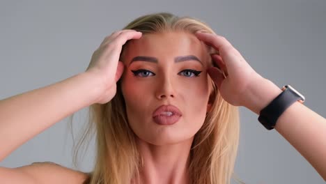 beautiful blonde girl looks up and stares into camera in slow motion beautiful blonde girl looks up and stares into camera in slow motion