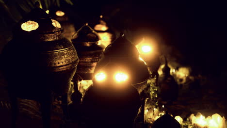 lamps glow at a peaceful outdoor gathering during a night celebration