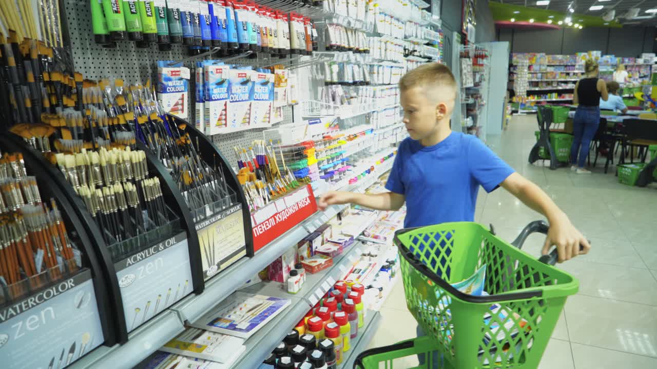 VINNITSA, UKRAINE - AUGUST 20, 2018: Buying school supplies at the supermarket. School goods in the store.