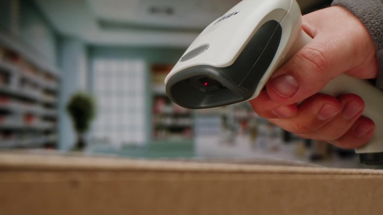 Scanner scan delivery box in storage, E-commerce shop, man packing goods and clothes second hand delivery market, courier Packaging and Shipping Workspace with Supplies and Technology, online sales.