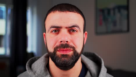 Contented-Man-Smiling-At-Camera.---closeup-shot