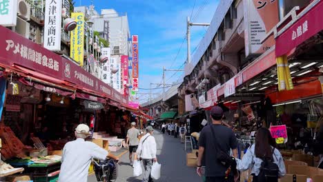 busy street market in tokyo, japan