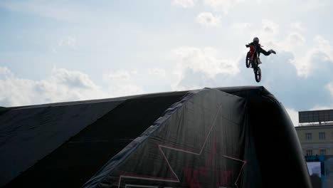 motocross stunt riders in mid-air