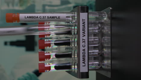 lambda c37 variant test tube samples being removed from rack