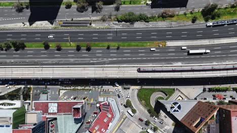 aerial view of city with train and road traffic
