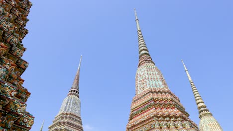 ornate temple stupas under clear sky in bangkok, thailand