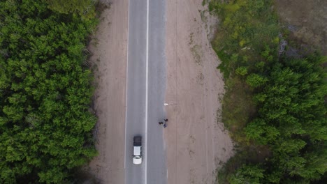 small group of people walking on rural road, mar de las pampas in argentina