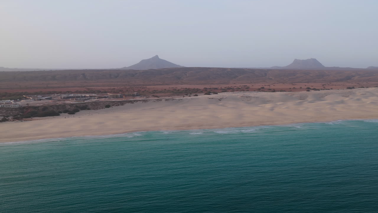 Nice Praia de Chaves ( Chaves beach) popular tourist destination.Coastline aerial view and background a volcanic mountain.Boa Vista island in the Atlantic Ocean.Cape Verde, Africa