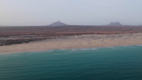 nice praia de chaves ( chaves beach) popular tourist destination.coastline aerial view and background a volcanic mountain.boa vista island in the atlantic ocean.cape verde, africa