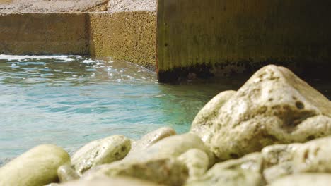 fresh salt water flowing into the tunnel towards the salt flats in kralendijk, bonaire