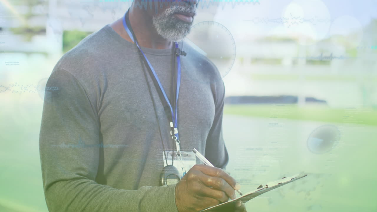 Coach writing notes on clipboard outdoors, displaying sports tech graphs and circular interfaces