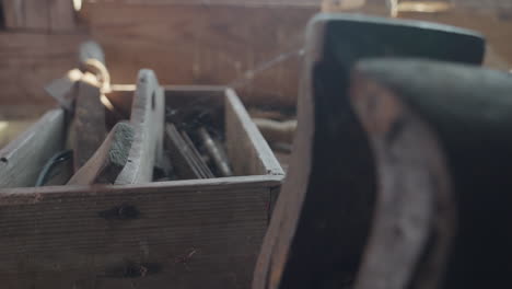 old wooden vintage tool box with dust and spider web in basement, pan, day