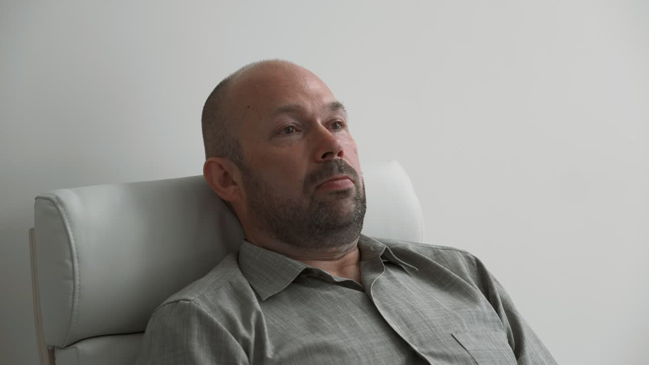 Man Sitting in a Chair