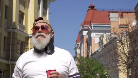 modern senior man take photo of sights of the city walking alone