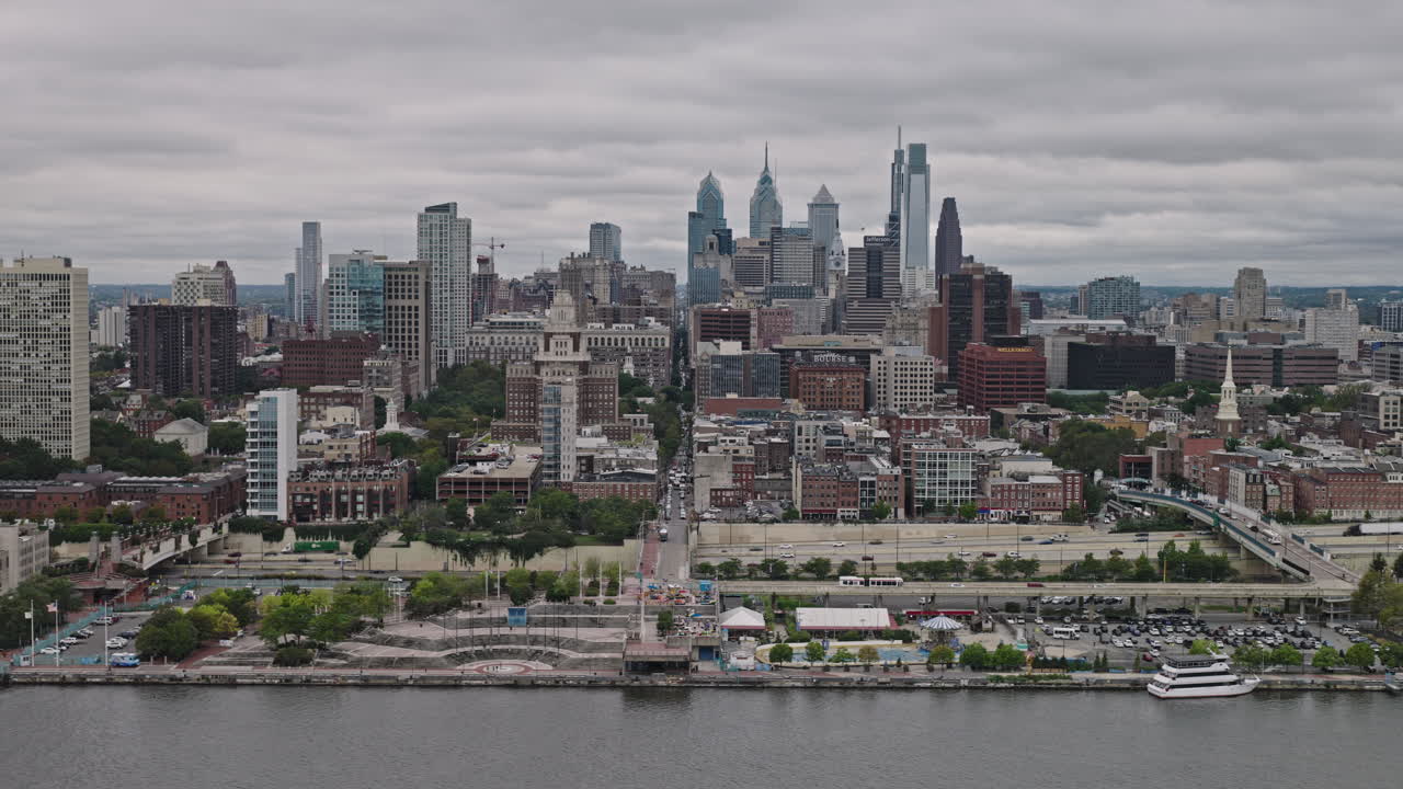 Philadelphia Pennsylvania Aerial v174 cinematic tracking flyover Delaware river capturing waterfront Old City and the downtown cityscape under an overcast sky - Shot with Inspire 3 8k - Sept 29th 2023
