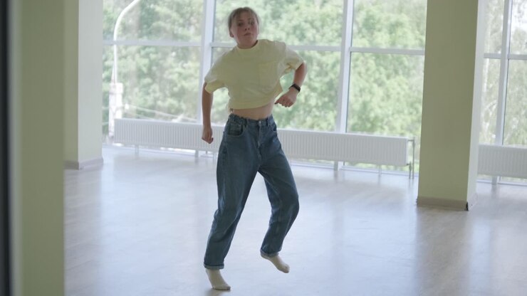 Young Girl Breakdancing in Modern Studio