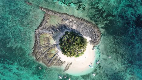 birds eye aerial view of small uninhabited guyam island in siargao archipelago, philippines