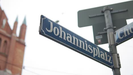 close up of johannisplatz street sign, wiener platz, munich germany, slow motion