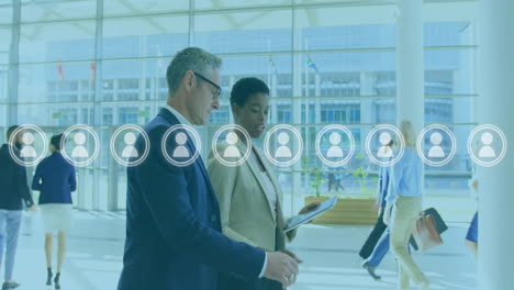 animation of people icons and data processing over diverse business people in office