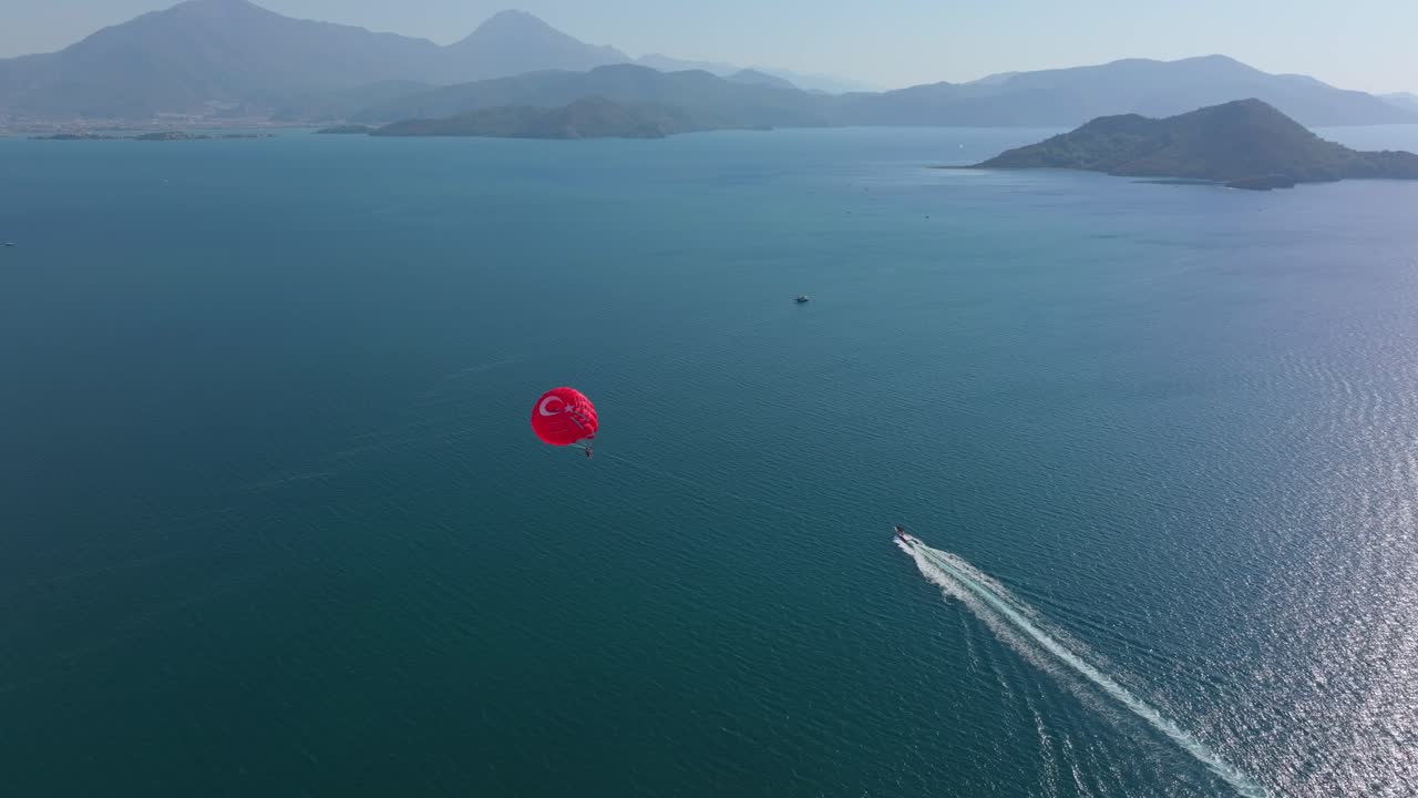 Overhead shot of parasail soaring above Turkish Mediterranean coast
