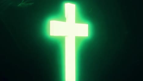 glowing cross on dark background