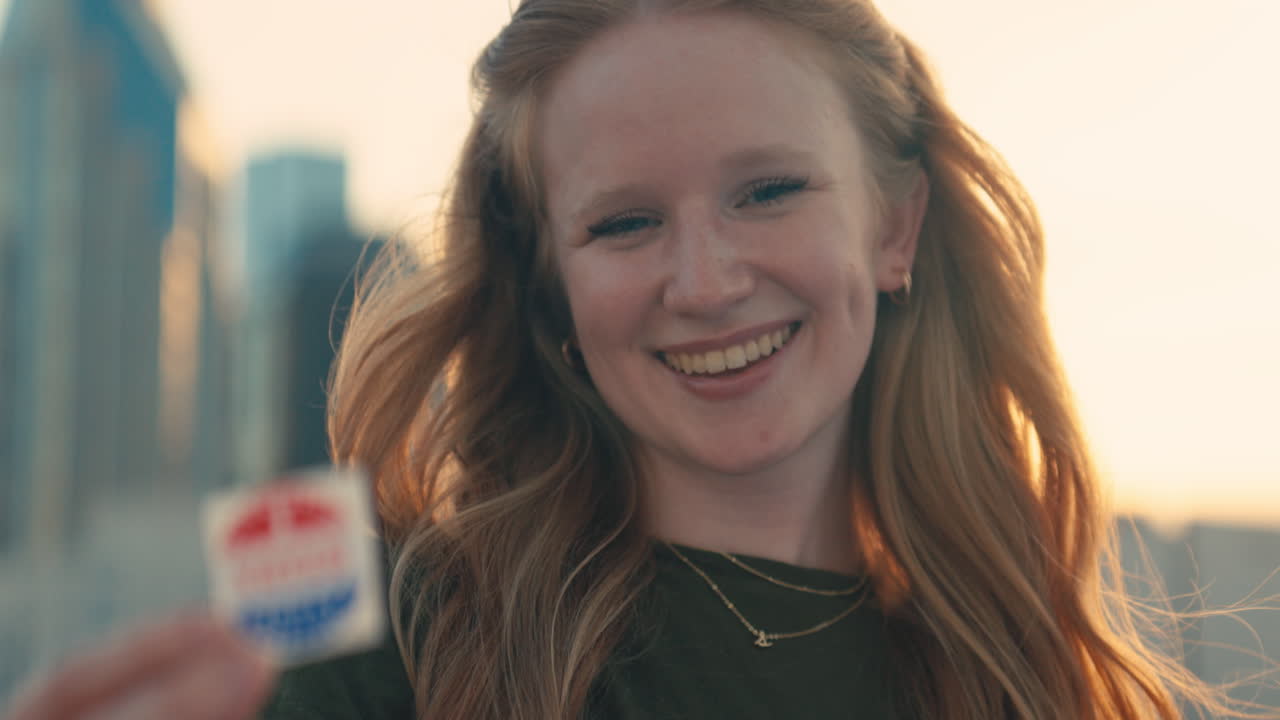 Woman holding 'I Voted Today' sticker