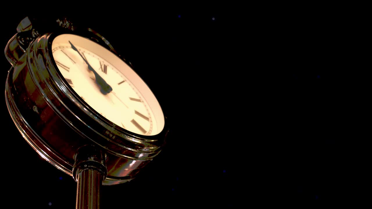 Time-lapse of an illuminated city clock in Georgia, with its hands moving against a dark night sky